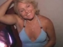 MILF sucks a train of cocks from the glory hole