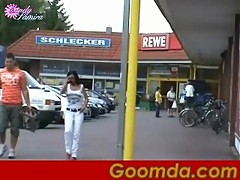 Brunette whore sucks in public